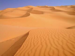 Fototapeta na wymiar Libya. Desert landscape with sand dunes around the town of Sebha.