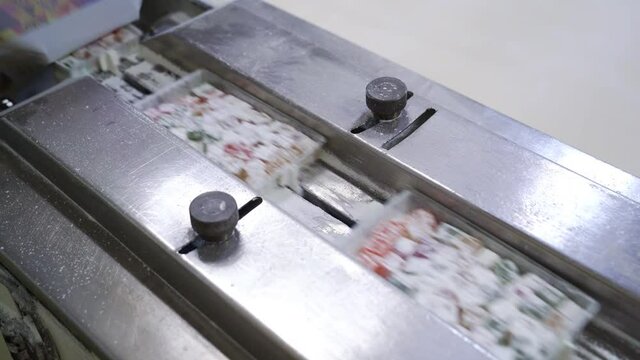 conveyor. packing of colorful Turkish delight and marmalade at candy factory.