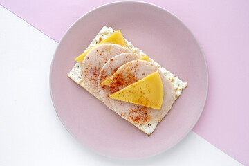 Salty crackers with sausage chicken, cheese and paprika