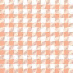 Gingham pattern in pastel orange and white. Seamless vichy check plaid for tablecloth, napkins, packaging, wrapping, or other modern spring and summer textile prints.