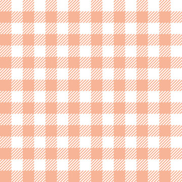 Gingham pattern in pastel orange and white. Seamless vichy check plaid for tablecloth, napkins, packaging, wrapping, or other modern spring and summer textile prints.