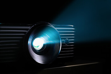 Modern video projector on dark background, closeup