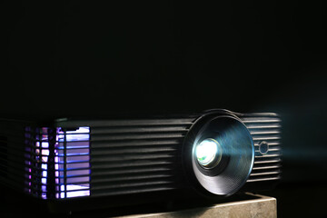 Modern video projector on dark background