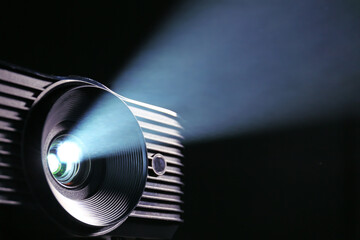 Modern video projector on dark background, closeup