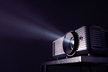 Modern video projector on dark background