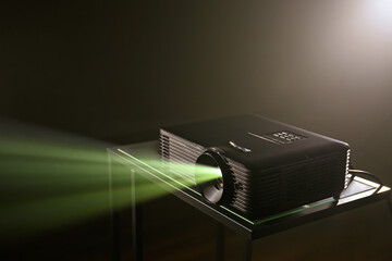 Modern video projector on dark background