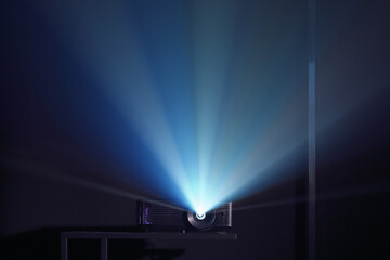 Modern video projector on dark background