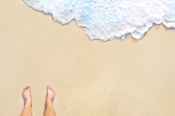 standing on the beach with wave motion coming to the foot