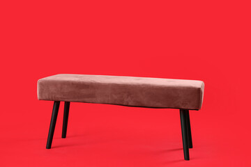 Stylish bench on color background