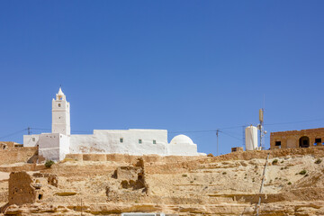 White mosque on top of a hill in Berber village, Sahara