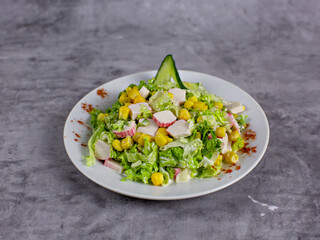 Vegetable salad with crab sticks