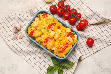 Tasty baked pasta in dish on grey background