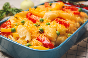 Tasty baked pasta in dish on table, closeup