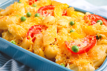 Tasty baked pasta in dish on table, closeup