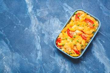 Tasty baked pasta in dish on color background
