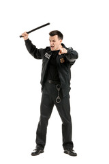 Aggressive police officer with baton on white background