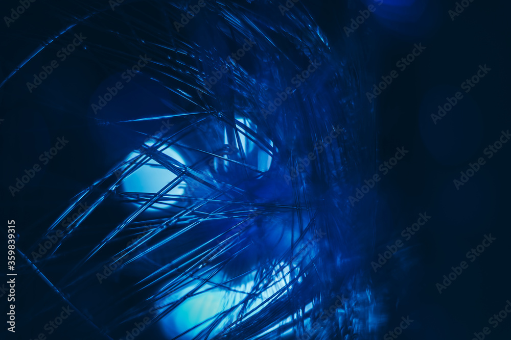 Poster beautiful optical fiber colored line bokeh on a dark background.