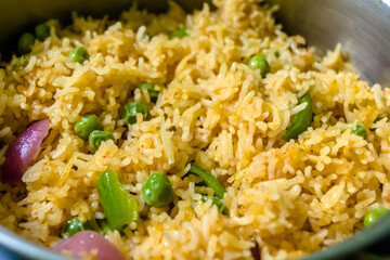 Homemade Chinese fried rice with vegetables, Veg Schezwan Fried Rice, peas, peppers, green beans, carrot. Selective Focus, Top view
