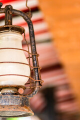 Fototapeta na wymiar closeup iron and rusty oil lamp, vertical rustic design photo