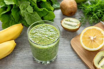 Healthy green smoothie made from fruits, vegetables and greens.