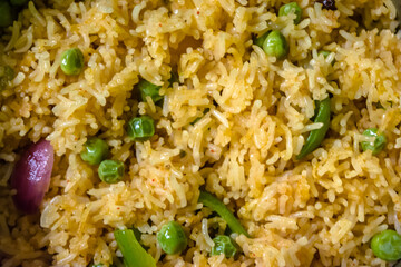 Homemade Chinese fried rice with vegetables, Veg Schezwan Fried Rice, peas, peppers, green beans, carrot. Selective Focus, Top view
