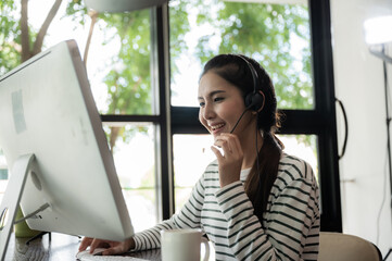 Young Asian operator woman with headsets work in call center, work from home, Team operator call...