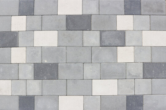 Neatly laid gray paving slabs. Abstract background.