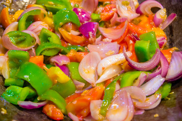 Stir fried colorful vegetables in a wok, Healthy food. Concept for a tasty and healthy vegetarian meal. Close up
