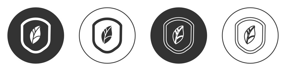 Black Shield with leaf icon isolated on white background. Eco-friendly security shield with leaf. Circle button. Vector Illustration.