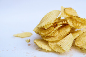 crunchy potato chips on white background