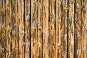 wooden pattern from vertical brown planks and old weathered dark brown background