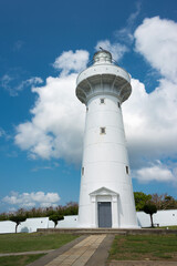 Fototapeta na wymiar Eluanbi Lighthouse at Eluanbi Park in Hengchun Township, Pingtung County, Taiwan. It was originally built in 1883.