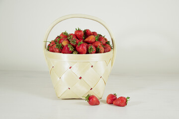 Ripe fresh red strawberries in a basket 