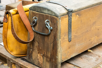 old wooden chest close-up used as a camping safe and a bag for storing documents