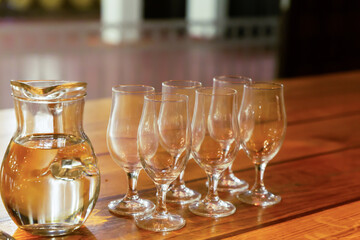 champagne glasses set and carafe banquet table on a wooden table decor holiday wedding, birthday