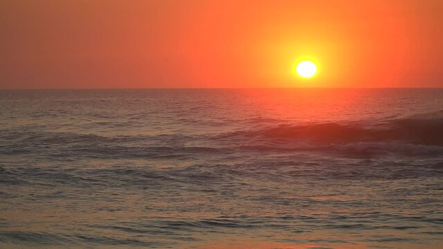 Sunset on a wavy beach in north Spain