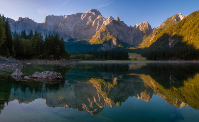 Panorama of an alpine lake on a beautiful sunny morning