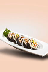 Sushi or susyi is a Japanese food consisting of rice that is formed with side dishes in the form of seafood, meat, raw or cooked vegetables