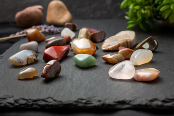 A view of a collection of smooth tumbled stones and pebbles, in a still life setting.
