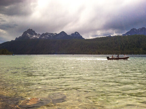 fishing and boating on Redfish Lake under the Sawtooth Mountains in Stanley, Idaho