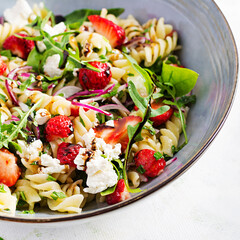 Pasta salad. Fusilli Pasta - salad with strawberry, feta cheese, red onion and balsamic sauce.