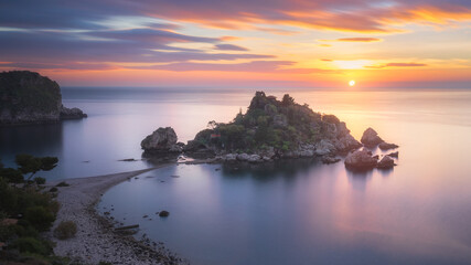 A sunrise captured at the famous location called Isola Bella in Sicily, Italy.