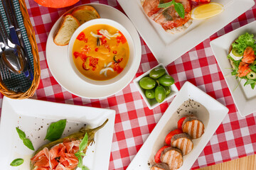 Traditional Italian cuisine, Italian concept. Sea food soup, grilled meat, traditional bruschetta.