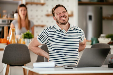 Young man working on project. Handsome man working at home.	
