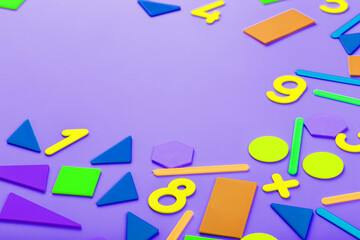 Colorful figures and numbers for children on a pink background. A tool for developing children's thinking.