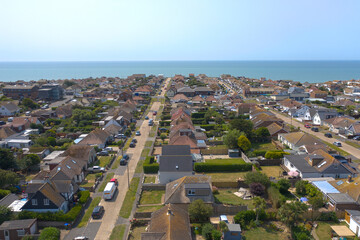 Aerial photo of  Peacehaven on the East Sussex coast looking towards the English Channel on a warm and sunny summers day.