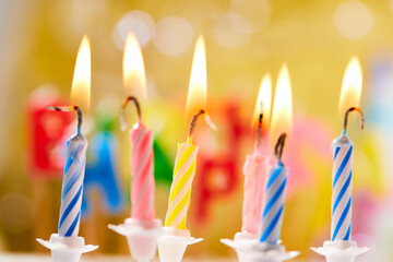 birthday candles on yellow background