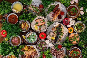 Traditional Georgian cuisine. Matzoon Okroshka, Khash Chikhirtma Harcho Soup. Celebration, party table.
