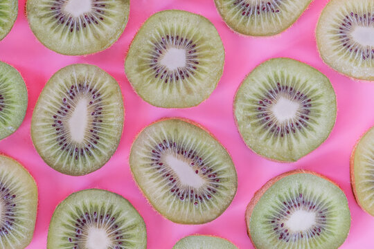 Collection of fresh Kiwi slice isolated on pink background.