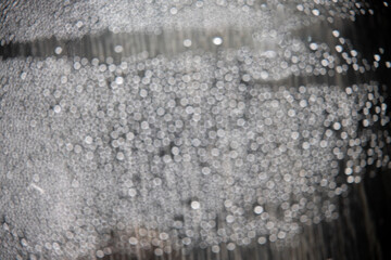 out of focus water drops in closeup creating bokeh background